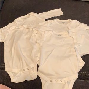 Brand new never worn 5 pack white onesies!
